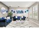Stylish living room with plush sofas, elegant decor, and large windows, creating a bright and inviting space at 19313 Pummelo Dr, Orlando, FL 32827
