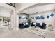 Spacious living area with elegant decor, plush seating, and abundant natural light, creating a cozy ambiance at 19313 Pummelo Dr, Orlando, FL 32827