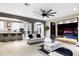 Stylish living room with bar seating overlooking the pool and outdoor spaces through sliding glass doors at 19313 Pummelo Dr, Orlando, FL 32827