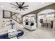 Open-concept living area with staircase, views to the kitchen, and elegant design at 19313 Pummelo Dr, Orlando, FL 32827