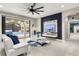 Modern living room with a view of the pool, featuring a built-in entertainment center and contemporary finishes at 19313 Pummelo Dr, Orlando, FL 32827