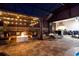 An outdoor living space is provided with a fire pit, outdoor kitchen, dining area, and lounge chairs at 19313 Pummelo Dr, Orlando, FL 32827