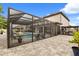 Relaxing screened-in pool area with lounge seating and landscaped plants at 19313 Pummelo Dr, Orlando, FL 32827
