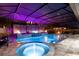 Enclosed pool area features a cascading waterfall, fire bowls, and a relaxing seating area at 19313 Pummelo Dr, Orlando, FL 32827