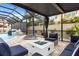 An inviting outdoor living space with an in-ground pool, water features, and a cozy fire pit at 19313 Pummelo Dr, Orlando, FL 32827