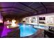 Magnificent outdoor pool and spa area featuring a fire feature and covered lanai with an outdoor kitchen at 19313 Pummelo Dr, Orlando, FL 32827