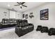 Cozy theater room equipped with comfortable seating and plush pillows for an optimal viewing experience at 19313 Pummelo Dr, Orlando, FL 32827