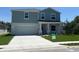 Charming two-story home featuring a two-car garage and a well-manicured front yard at 2005 Canton Park Dr, Winter Haven, FL 33881