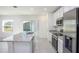 Bright kitchen featuring stainless steel appliances, granite countertops, and a center island sink at 2005 Canton Park Dr, Winter Haven, FL 33881