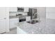 Bright kitchen featuring stainless steel appliances, granite countertops, and a center island sink at 2005 Canton Park Dr, Winter Haven, FL 33881