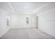 Spacious main bedroom with tray ceiling, carpet, and large windows for natural light at 2005 Canton Park Dr, Winter Haven, FL 33881
