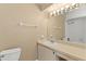 Bright bathroom with a large mirror, single sink vanity, and a bathtub at 2539 Antilles Dr, Winter Park, FL 32792