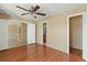 This light and airy bedroom features wood-style floors and access to the bathroom at 2539 Antilles Dr, Winter Park, FL 32792