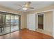 A charming bedroom with wood floors, adjacent to a screened outdoor patio space at 2539 Antilles Dr, Winter Park, FL 32792