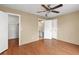 This neutral bedroom is designed with attractive wood floors and multiple access doors at 2539 Antilles Dr, Winter Park, FL 32792