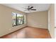 A well-lit bedroom is enhanced by wood floors and a large window at 2539 Antilles Dr, Winter Park, FL 32792
