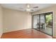 This bedroom has stylish wood floors and sliding glass doors to an outdoor space at 2539 Antilles Dr, Winter Park, FL 32792