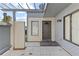 Home front entrance with modern door, windows, and landscaped walkway, showcasing curb appeal at 2539 Antilles Dr, Winter Park, FL 32792