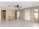 Open concept living room with tile flooring, mini-bar, and great natural light from a large window at 2539 Antilles Dr, Winter Park, FL 32792