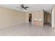 Bright living room with tile flooring, ceiling fan, and a convenient wet bar area for entertaining guests at 2539 Antilles Dr, Winter Park, FL 32792