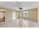 Inviting living room with tile floors, neutral walls, and large windows providing ample natural light at 2539 Antilles Dr, Winter Park, FL 32792