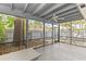 Enclosed outdoor patio featuring screened walls and backyard views at 2539 Antilles Dr, Winter Park, FL 32792