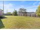 Large backyard with a grass lawn and a wood fence at 2540 Courtland Blvd, Deltona, FL 32738