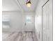 Clean and bright entryway with a decorative front door, wood floors, and neutral decor at 2540 Courtland Blvd, Deltona, FL 32738