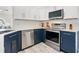 Bright kitchen showcases white cabinets, stainless steel appliances, and plenty of counter space at 2540 Courtland Blvd, Deltona, FL 32738