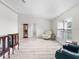 Bright living room with wood floors, neutral walls, and ample natural light from a large window at 2540 Courtland Blvd, Deltona, FL 32738
