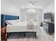 Spacious main bedroom with vaulted ceiling, modern fan, and ample natural light at 2540 Courtland Blvd, Deltona, FL 32738