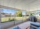 Screened-in patio with a grill and seating at 2540 Courtland Blvd, Deltona, FL 32738