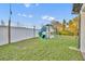 Backyard with a playground set and a well-maintained lawn at 2940 Scarlett Dr, St Cloud, FL 34772
