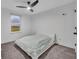 Bedroom with carpet, window and a bed with neutral comforter and sheets at 2940 Scarlett Dr, St Cloud, FL 34772