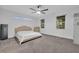 Bright bedroom with ample natural light, a king bed, neutral color scheme, and carpeted floors for a cozy feel at 2940 Scarlett Dr, St Cloud, FL 34772