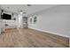 Versatile flex room with wood-look flooring, a large window, and built-in shelving providing ample storage space at 2940 Scarlett Dr, St Cloud, FL 34772