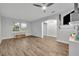 Versatile flex room with wood-look flooring, a large window, and a built-in shelving unit providing extra storage space at 2940 Scarlett Dr, St Cloud, FL 34772