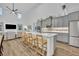 Modern open kitchen with barstool seating, stainless steel appliances, and modern finishes at 2940 Scarlett Dr, St Cloud, FL 34772