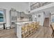 Modern kitchen with stainless steel appliances, a large island, and barstool seating at 2940 Scarlett Dr, St Cloud, FL 34772
