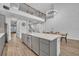 Spacious kitchen with large island, modern appliances, and an open floor plan that extends into the dining area and living space at 2940 Scarlett Dr, St Cloud, FL 34772