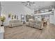 Open-concept living space with two-story ceilings, second story catwalk, and a living area that extends into the kitchen at 2940 Scarlett Dr, St Cloud, FL 34772