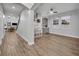 Bright, airy living room with hardwood floors, built-in shelves, and modern ceiling fan at 2940 Scarlett Dr, St Cloud, FL 34772