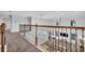Loft with iron railing overlooking the living room with lots of natural light at 2940 Scarlett Dr, St Cloud, FL 34772