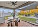 Covered patio with seating area, outdoor kitchen, and view of the spacious backyard at 2940 Scarlett Dr, St Cloud, FL 34772