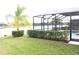 Beautiful backyard oasis with a screened-in pool and lake view at 3039 Boating Blvd. Blvd, Kissimmee, FL 34746