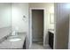 Bathroom with granite countertops, dark cabinets, and neutral wall tile at 3039 Boating Blvd. Blvd, Kissimmee, FL 34746