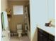Comfortable bathroom with a tub and shower, single vanity and tile floors at 3039 Boating Blvd. Blvd, Kissimmee, FL 34746