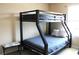 Bedroom showcasing bunk beds with sturdy black metal frames, neutral walls, and a small accent table at 3039 Boating Blvd. Blvd, Kissimmee, FL 34746