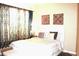 Inviting bedroom with soft lighting, ornate wall decor, and a plush bed for ultimate comfort at 3039 Boating Blvd. Blvd, Kissimmee, FL 34746