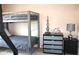 Bedroom with metal bunkbeds and dark dressers, enhanced by decorative accents and neutral carpeting at 3039 Boating Blvd. Blvd, Kissimmee, FL 34746